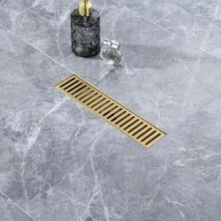 2.75 In. W X 12 In D Grid Shower Drain Stainless Steel Decorative Drain Cover With Brushed Gold -Tahanbath brushed gold tahanbath shower drains q pzz 7002lsj 12 31 1000