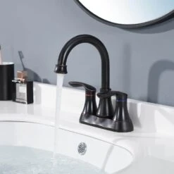4 In. 2-Handle Bathroom Faucet With Pop-Up Drain And Supply Hoses In Oil Rubbed Bronze